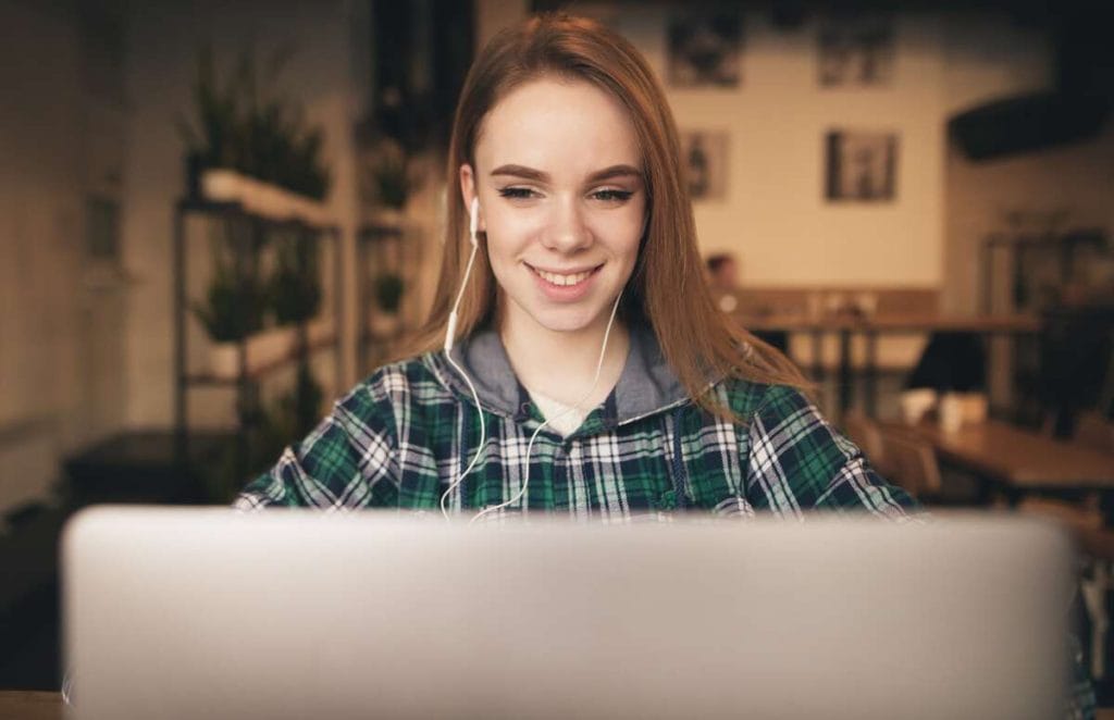 online-student-smiling-while-having-an-online-class