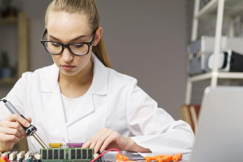 STEM Educated Female Technician with Electronics