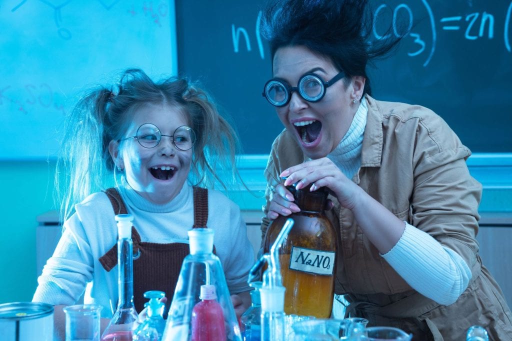 Teacher and a Little Girl Doing Experiments Together