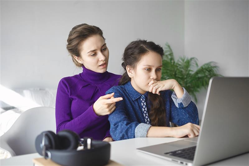 A parent helping their child prepare for high school